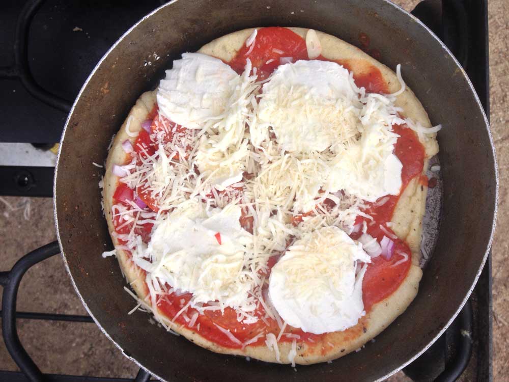 Toppings on the cooked pizza crust
